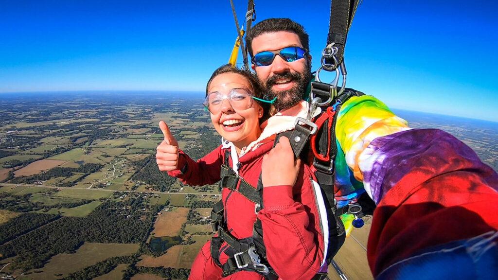 Tandem skydivers in freefall over Springfield